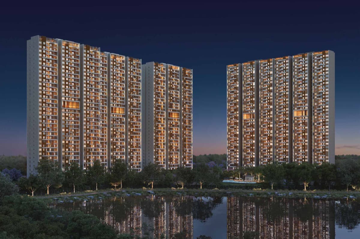 Residential towers reflected in the lake at sunset